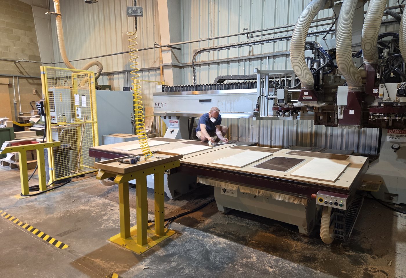 Engineer reviewing a client drawing and CNC programme at Sarivale